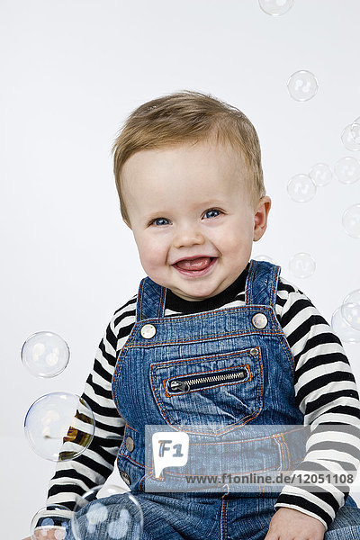 Portrait of Baby Boy Surrounded by Bubbles