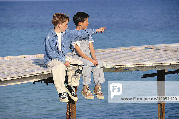 Boys Fishing off of Dock