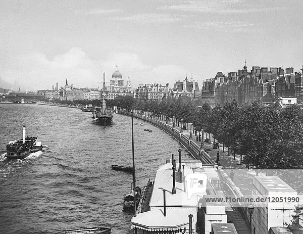 Magic Lantern slide circa 1900 views of London  England in Victorian times. Looking along the Victoria Embankment towards St Paul’s Cathedral.Pleasure paddle steamer on the Thames with sailing ships and small boats.