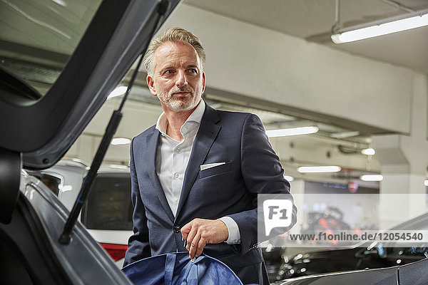 Businessman parking his car at the airport