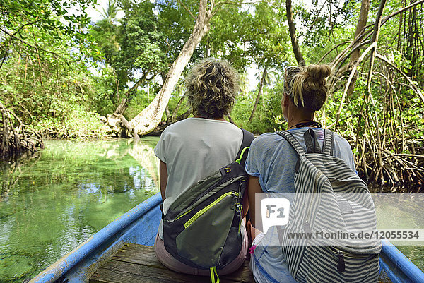 Dominican Republic  Samana  two women in a boat in mangrove lagoon