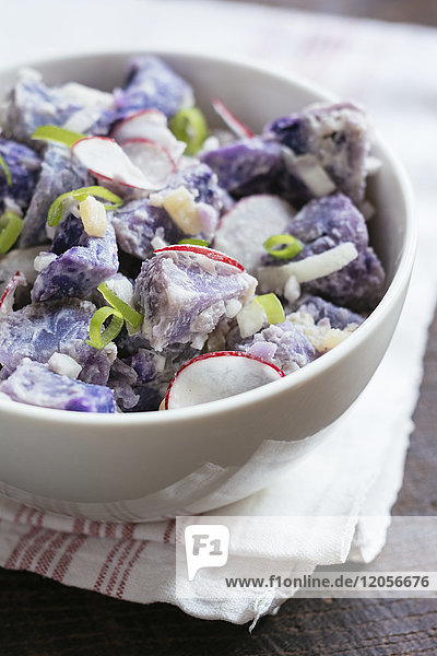 Purple potato salad with radishes