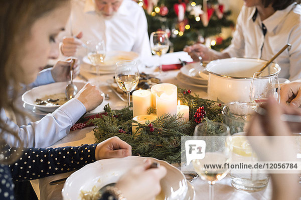 Family dining at Christmas dinner table