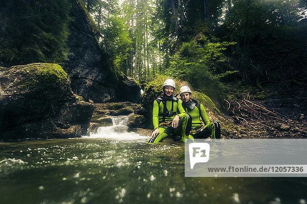 Germany  Bavaria  Allgaeu  young couple canyoning in Ostertal