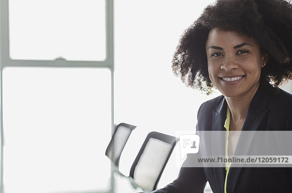 Portrait smiling  confident businesswoman in conference room