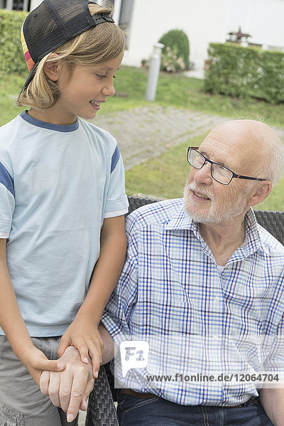 Grandfather with grandson at nursing home