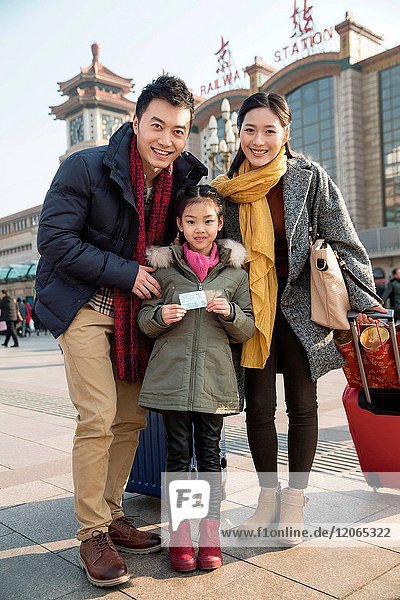 Happy family in front of the square