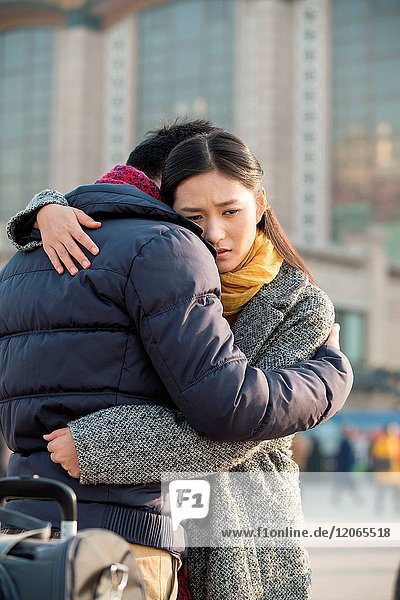 Young lovers at the railway station