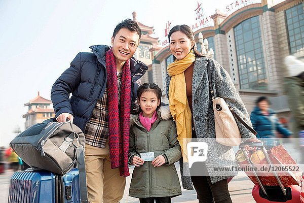 Happy family in front of the square