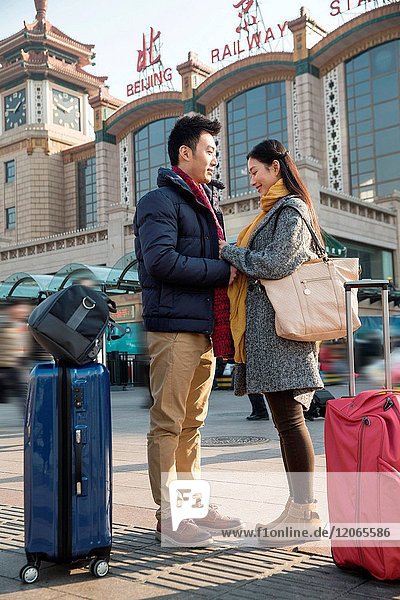 Young lovers at the railway station