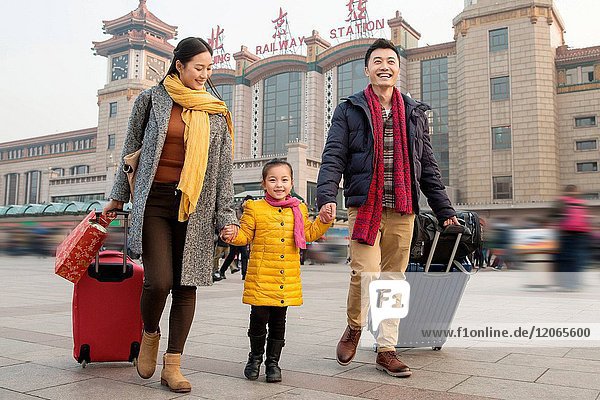 Happy family at the railway station