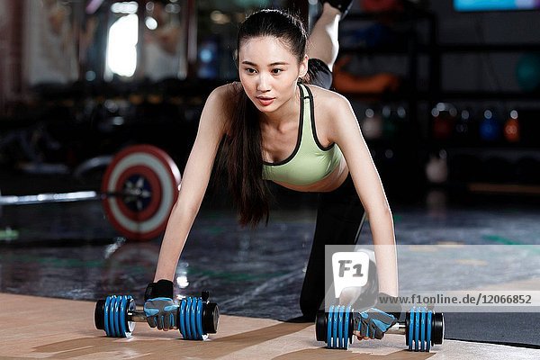 Young women exercise at the gym