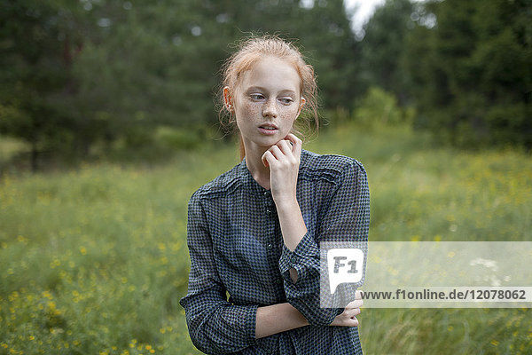 Portrait of Caucasian girl standing in field