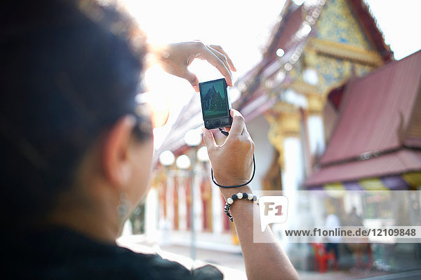 Woman photographing building with smartphone  Bangkok  Krung Thep  Thailand  Asia