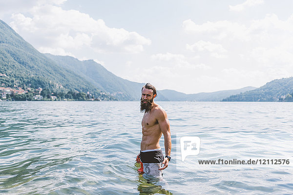 Portrait of young male hipster in Lake Como  Lombardy  Italy