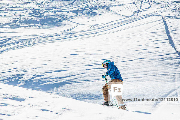 Skier skiing on mountainside