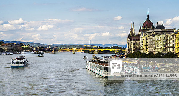 Boats and the waterfront of the Danube River and the Hungarian Parliament; Budapest  Budapest  Hungary