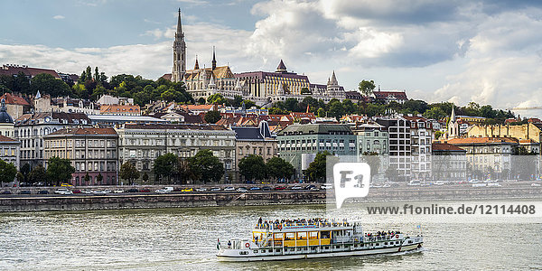 A tour boat travels down the Danube River past Budapest; Budapest  Budapest  Hungary