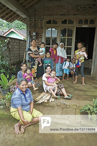Muslim women and children on a veranda  Podang Village  Magelang  Java  Indonesia  Asia