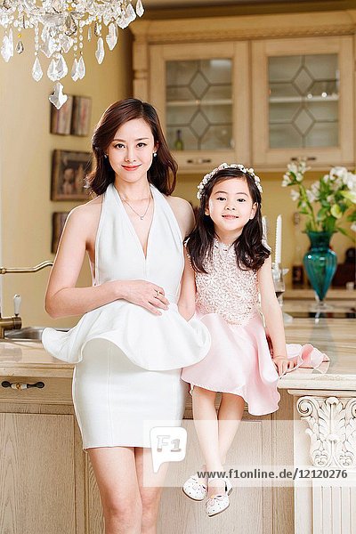 Fashionable dress mother and daughter
