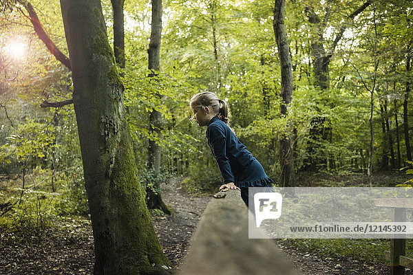 Girl playing in forest