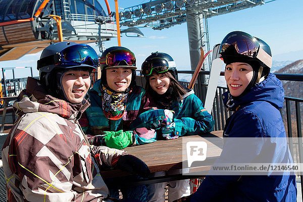 Young men and women outdoor skiing