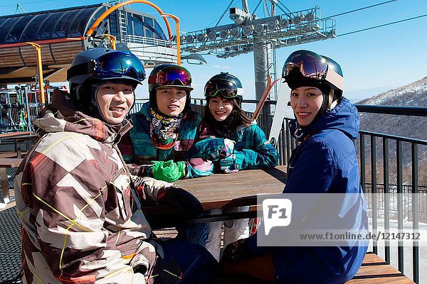 Young men and women outdoor skiing
