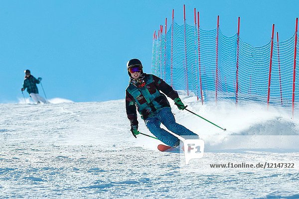 Young men and women outdoor skiing