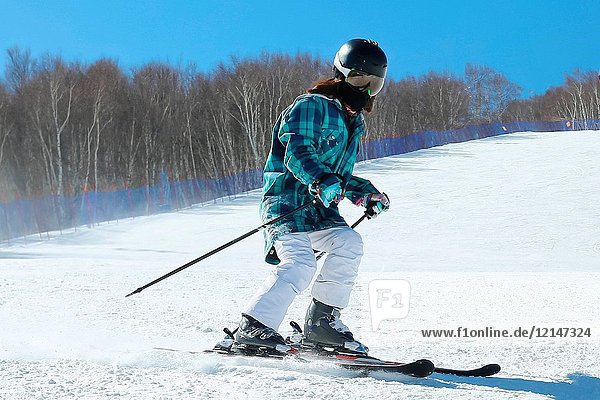 Young woman outdoor skiing