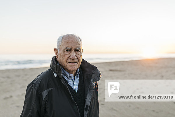 Senior man strolling at the beach