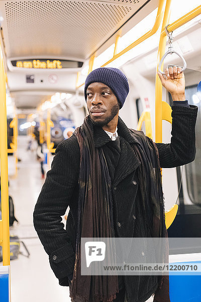 African american man in underground train