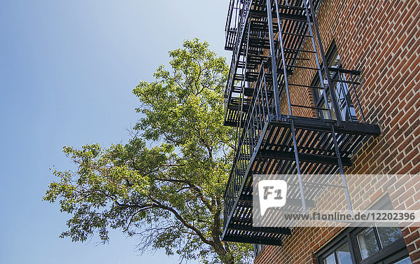 USA  New York  Brooklyn  Close up of fire escape over red brick facade