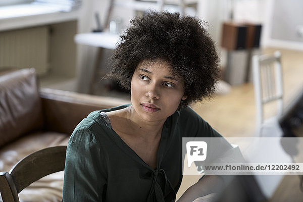 Portrait of serious young woman thinking