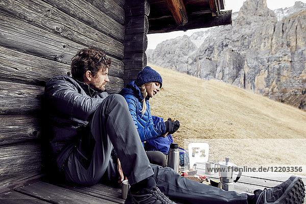 Couple having a break at mountain hut