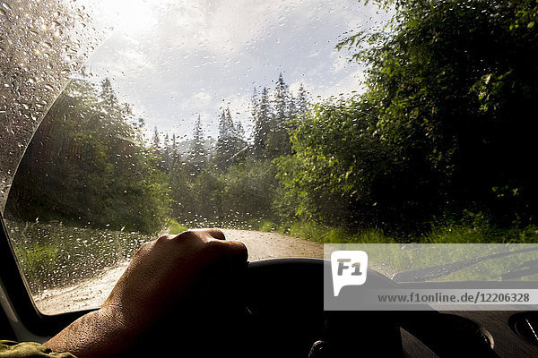 Windshield of car driving in rain