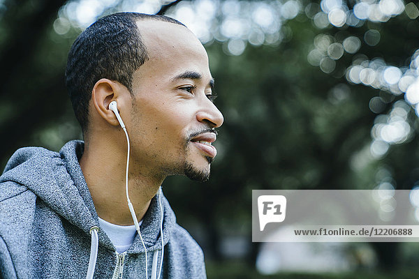 Black man listening to earbuds