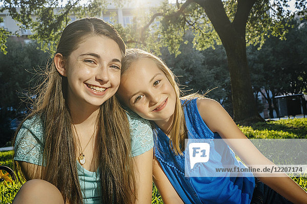 Portrait of smiling Caucasian girls in park
