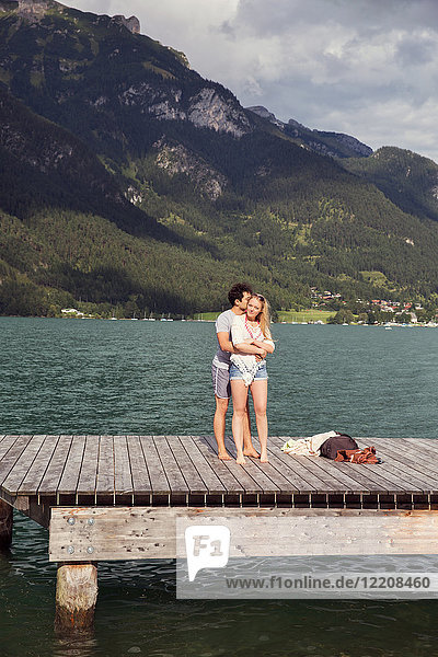 Couple hugging on pier  Innsbruck  Tirol  Austria  Europe