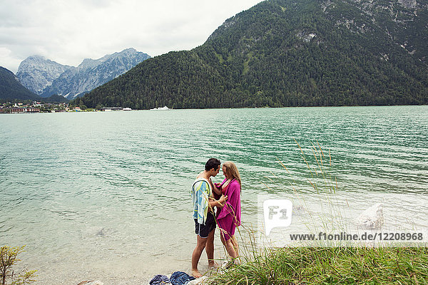 Couple wrapped in towel by Achensee  Innsbruck  Tirol  Austria  Europe