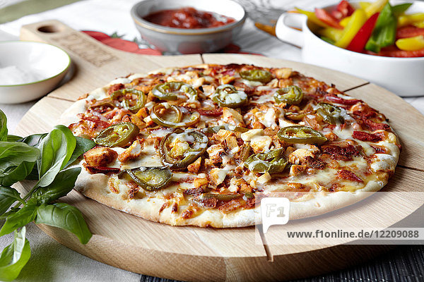 Fajita pizza on wooden pizza board  close-up