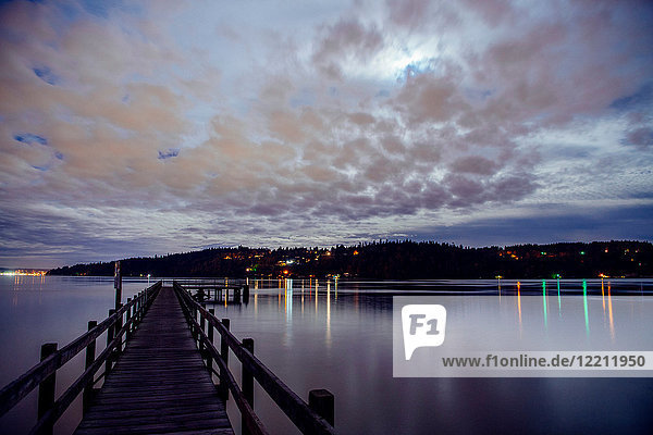 Lights across water on coastline from pier  Bainbridge  Washington  United States
