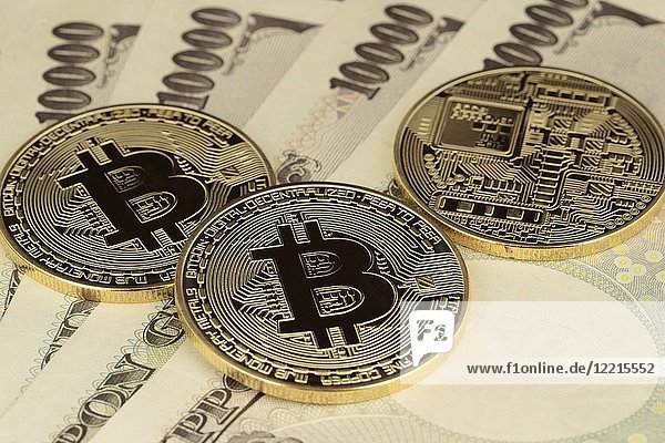 Virtual currency Golden Bitcoins on 10 000 Japanese Yen bills. (Photo by Rodrigo Reyes Marin).