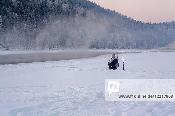 Man ice-fishing  Ural  Sverdlovsk  Russia