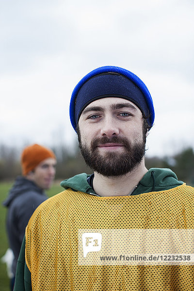 Portrait of a bearded Caucasian man in sports gear  outdoors.