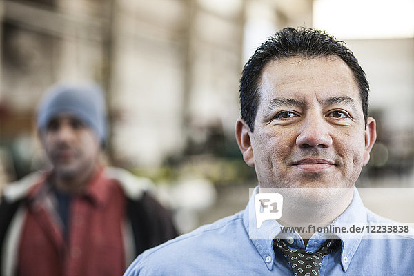 Hispanic man manager in a sheet metal factory.
