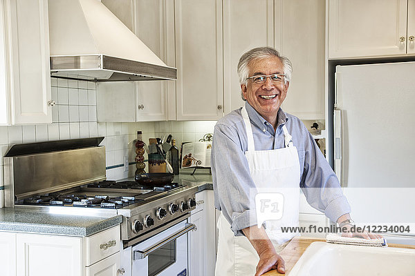 Hispanic senior man in his remodelled kitchen