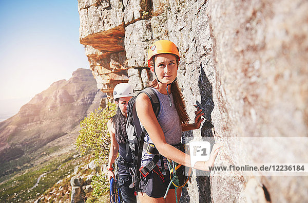 Portrait confident female rock climber