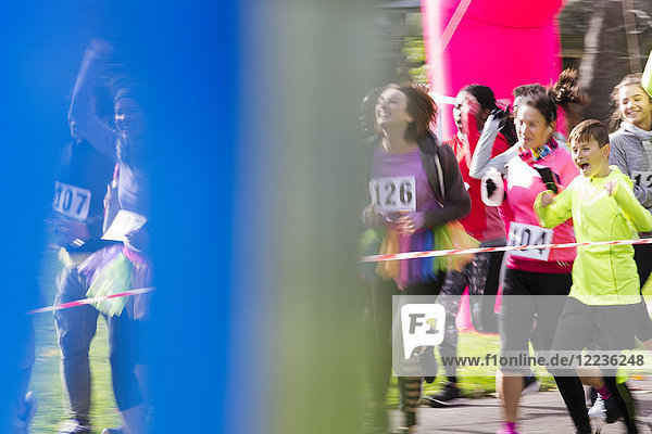 Runners cheering  running at charity run