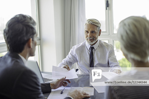 Businessman meeting with couple