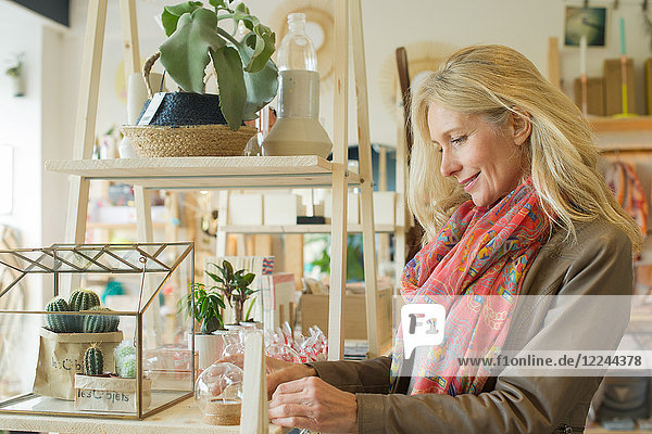 Mature woman shopping in home decorating store